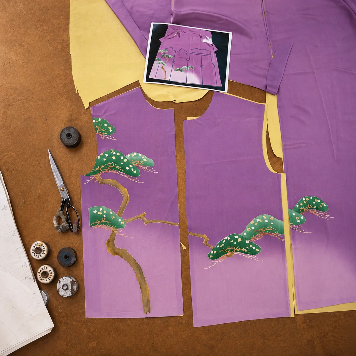 Carefully placing the kimono artwork before cutting each pattern.